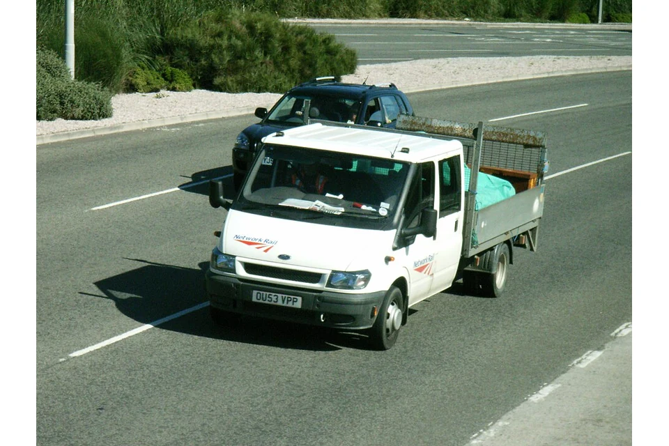 Pickup & dropside Single-cab dropside — photo of a Ford Transit 350 LWB dropside